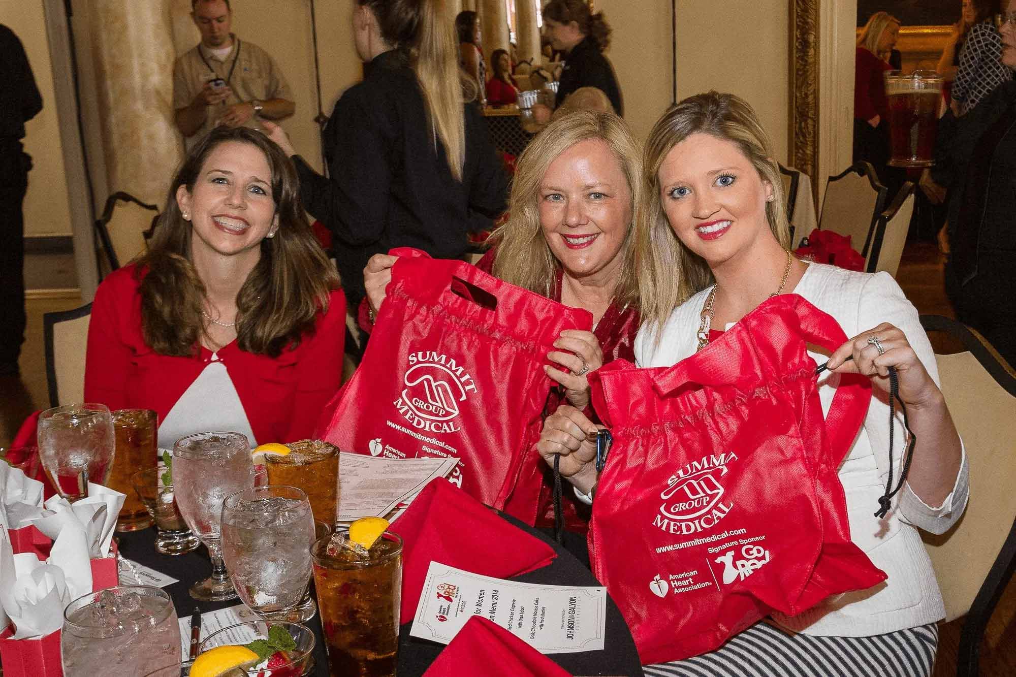Knoxville corporate event photography of attendees posing together at a fundraising event