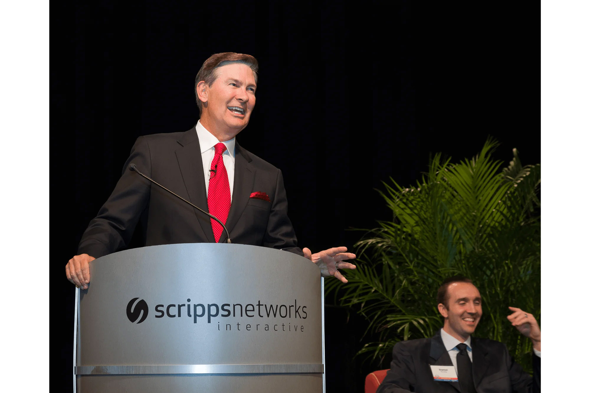 Knoxville corporate event photographer captures a business speaker presenting from a podium at a corporate event.