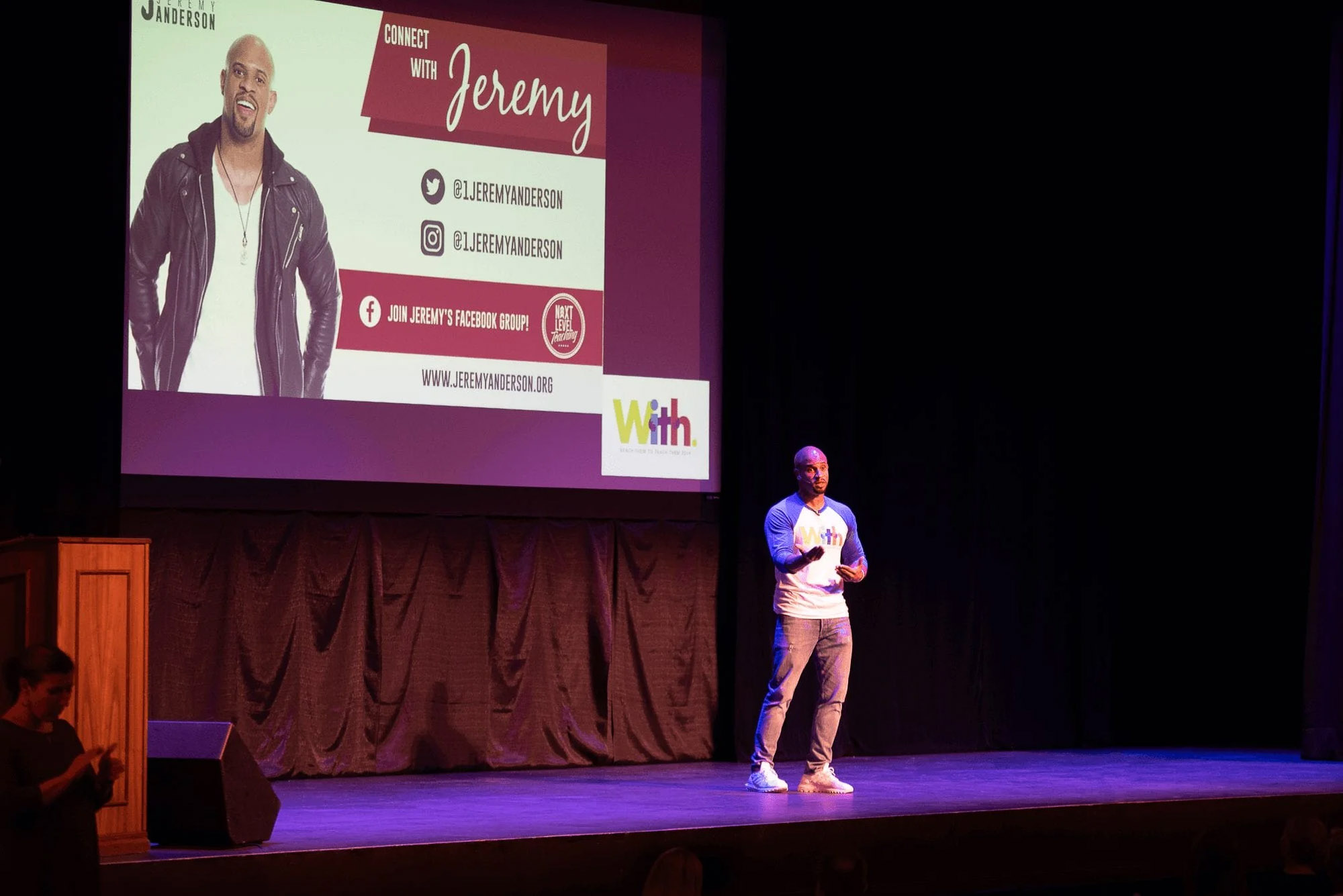 Knoxville corporate event photographer captures a keynote speaker presenting on stage at a business event.