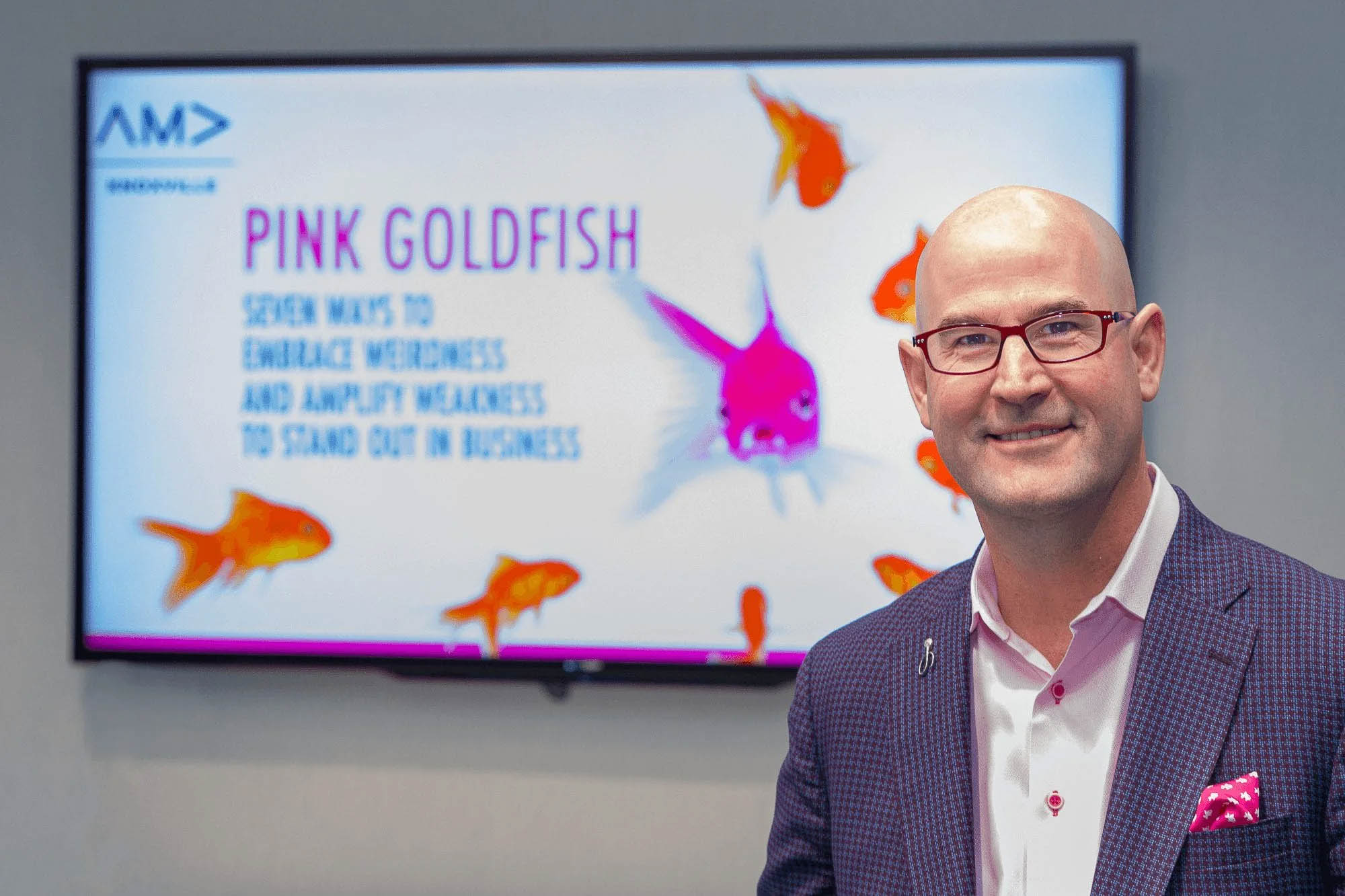 Knoxville corporate event photographer captures a business professional at a Pink Goldfish presentation.