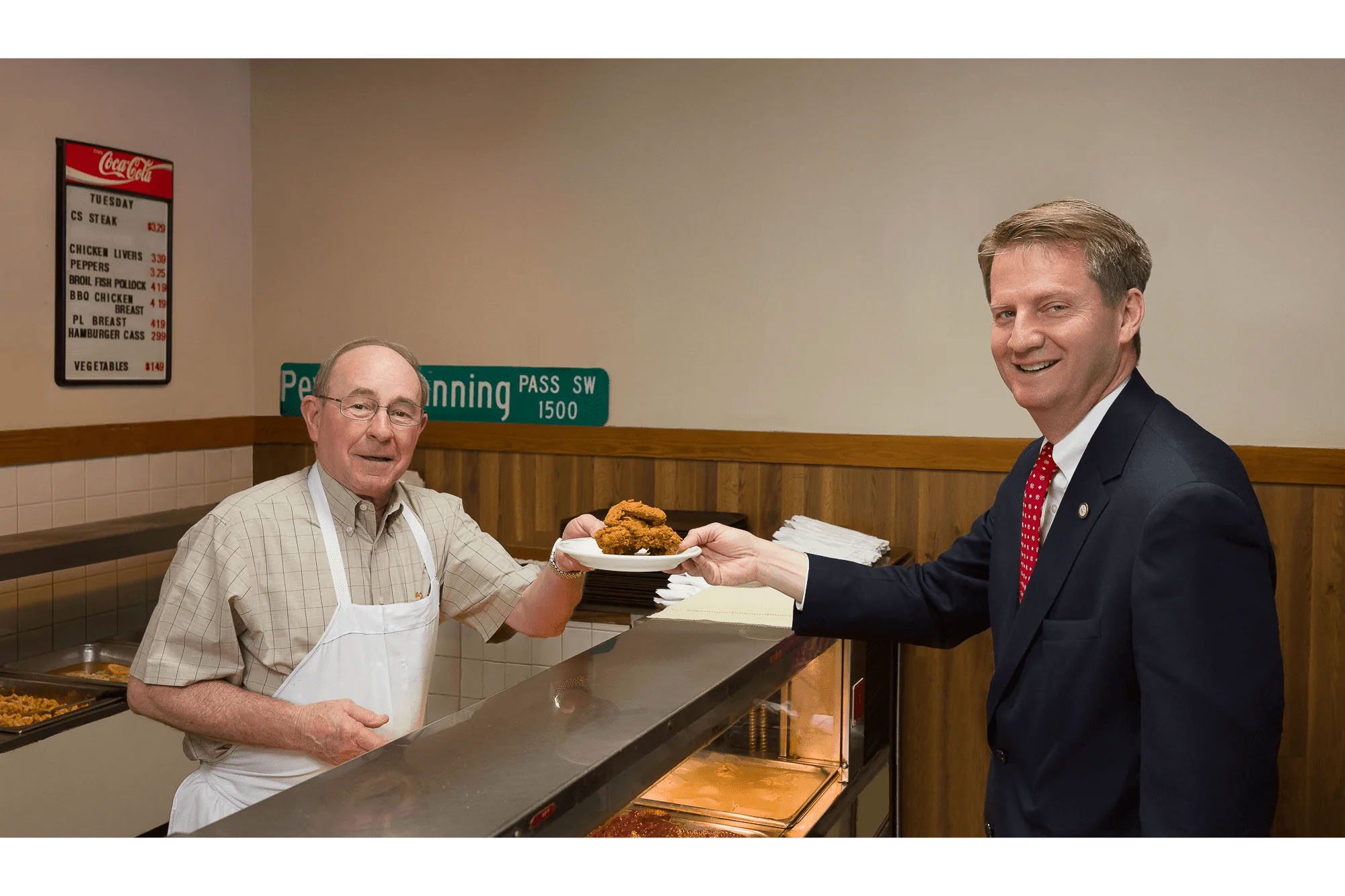Knoxville corporate event photographer captures two business professionals during a community event.